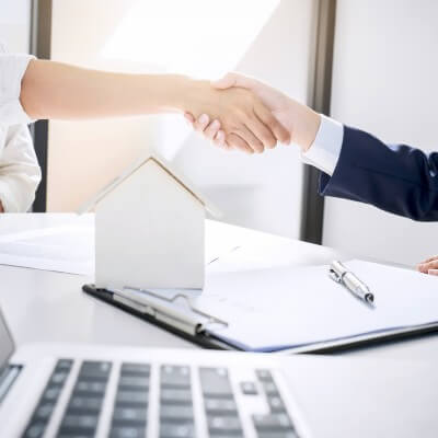 Shaking hands with real estate agent