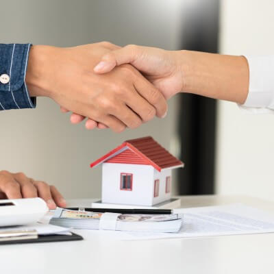 Shaking hands over new home